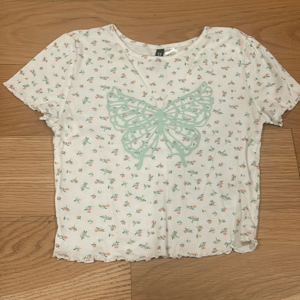 White top, flowers, and blue butterfly